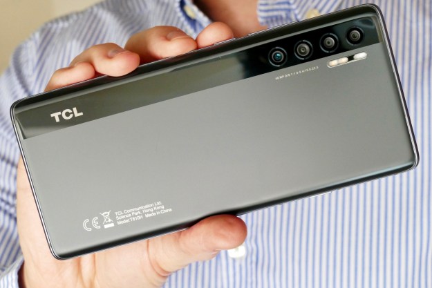 The TCL 20 Pro 5G seen from the back, held in hand.