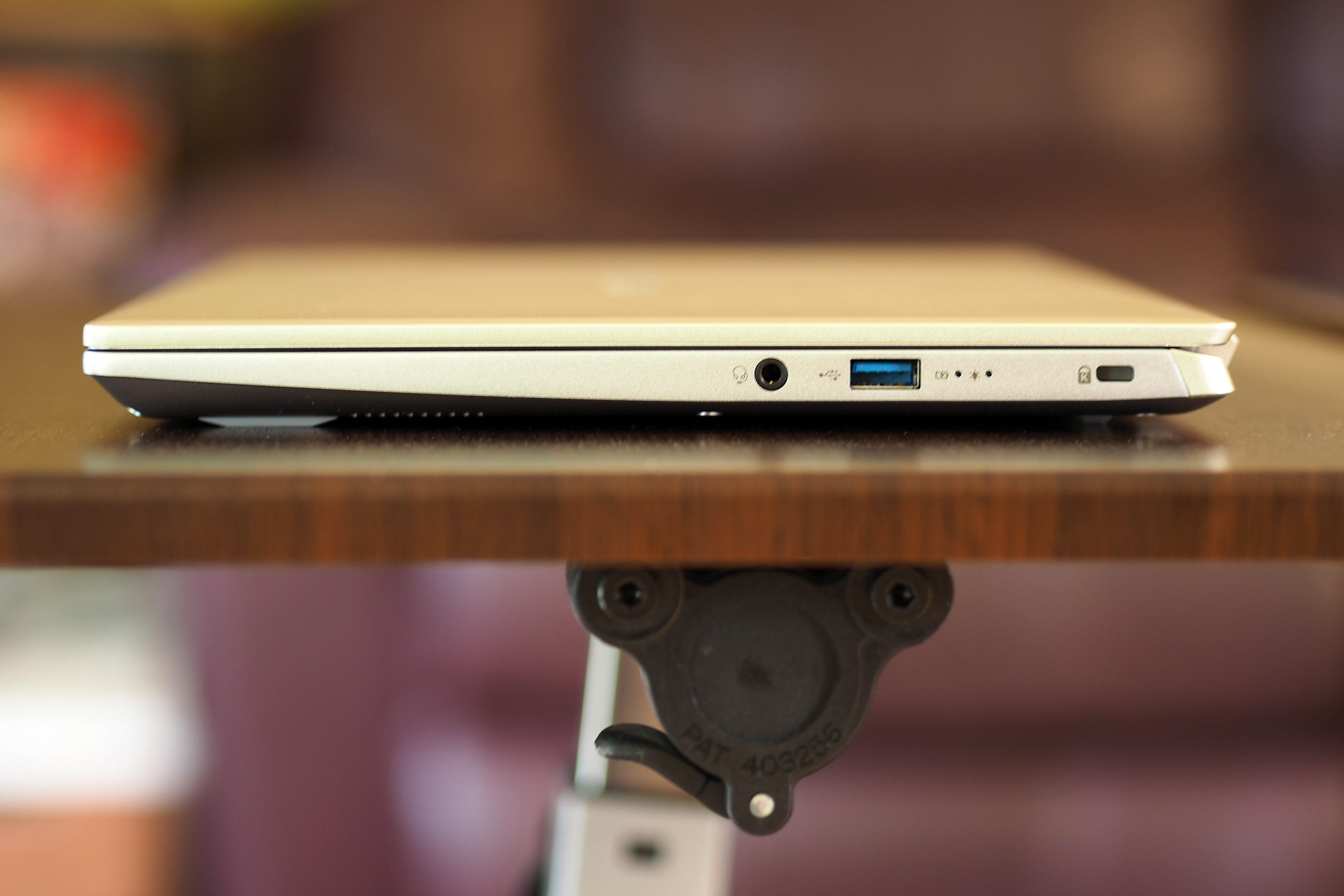 Acer Swift X right side ports and plugins. Headphone jack and USB port.