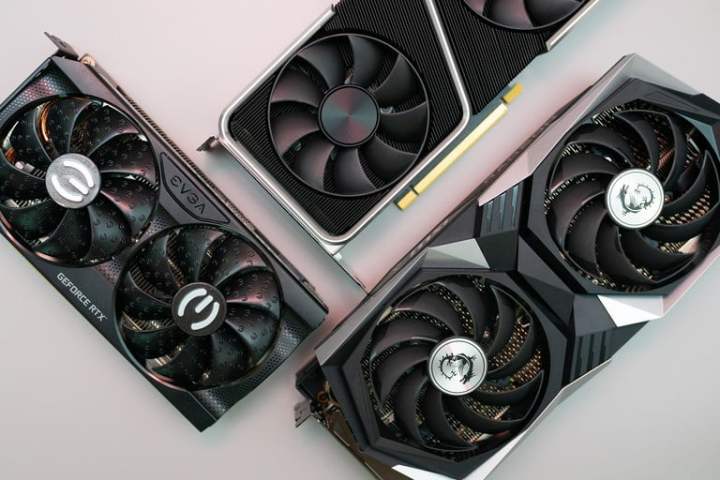 Three graphics cards on gray background.