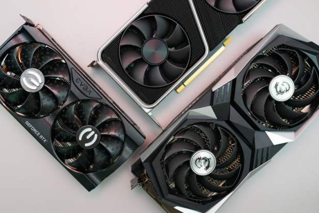Three graphics cards on a gray background.
