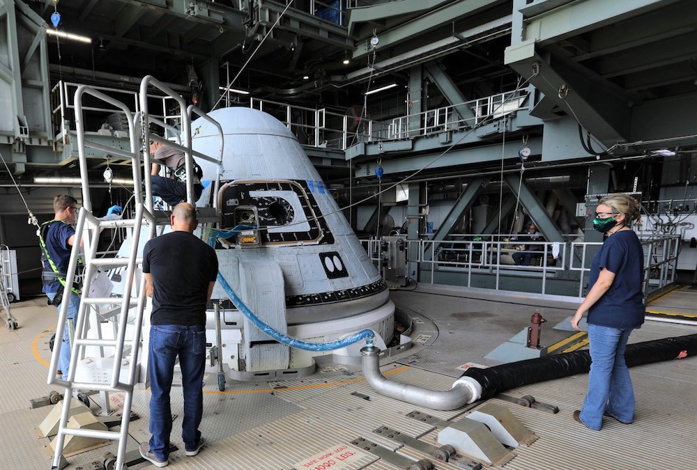 Engineers working on Boeing's Starliner spacecraft.