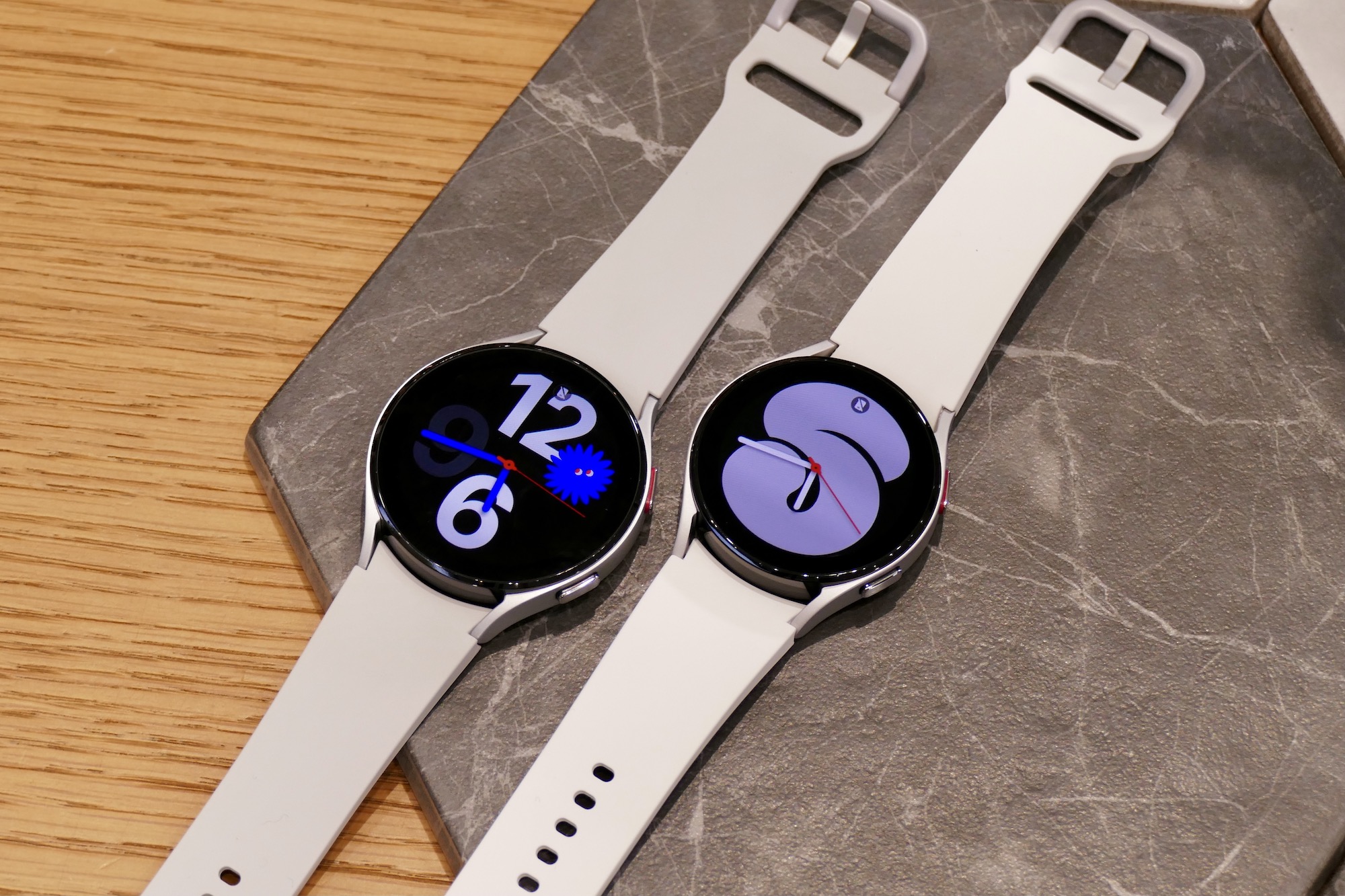 The Samsung Galaxy Watch 4 in white, in two sizes.