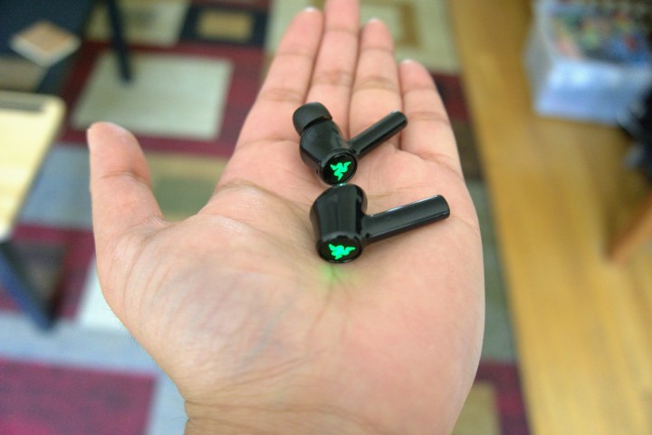 Razer Hammerhead held in the palm of your hand.