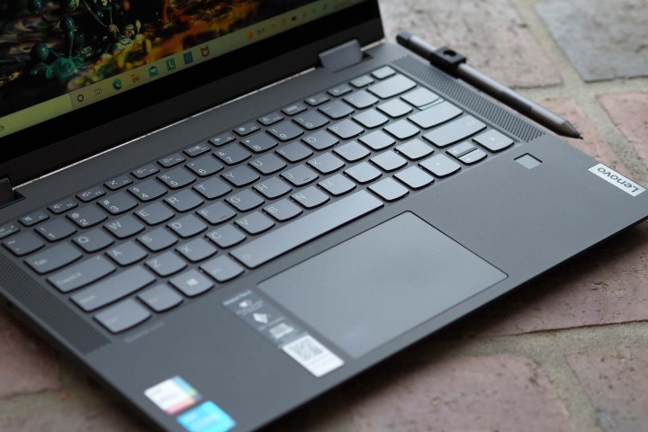 Image of the Lenovo IdeaPad Flex 5i 14, showing the keyboard, trackpad, and stylus.