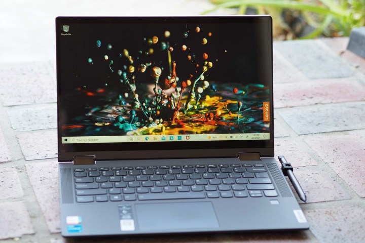 Image of an opened Lenovo IdeaPad Flex 5i 14 laptop sitting on the ground.