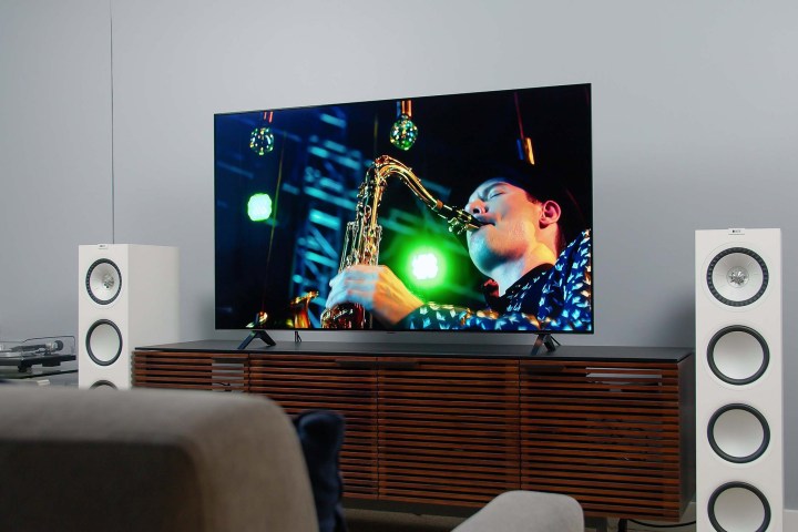LG A1 OLED 4K HDR TV screen displaying imagery of someone playing the saxophone.