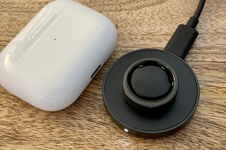 The Oura Ring on its charging dock.