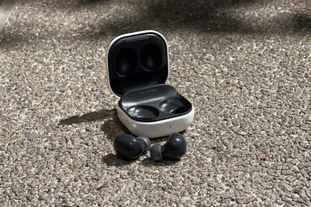 The Samsung Galaxy Buds 2 and their case sitting on the ground.