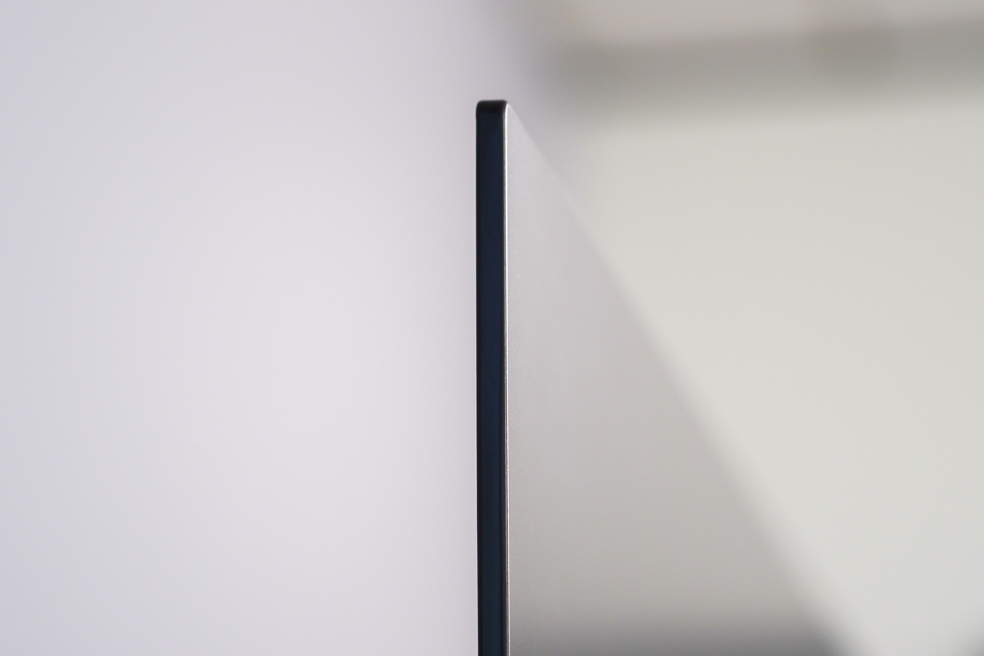 A side view of the Sony A80J 4K HDR OLED TV displaying just how thin the tv is.