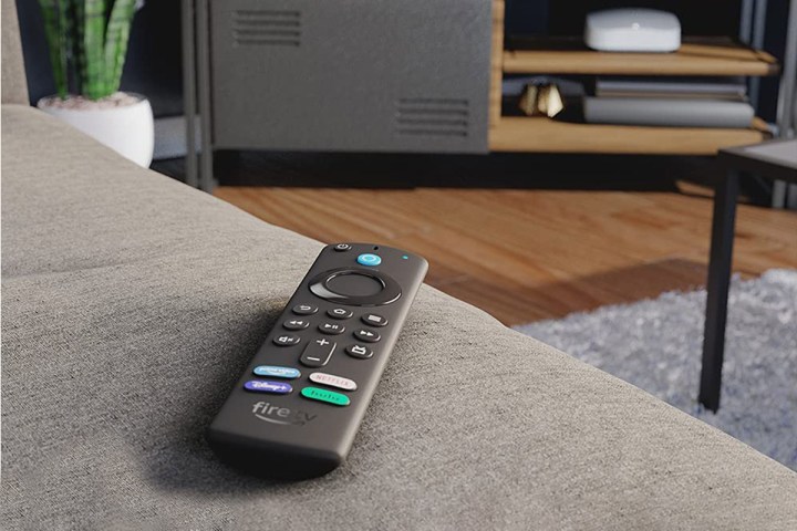 Amazon fire tv remote sitting on couch.