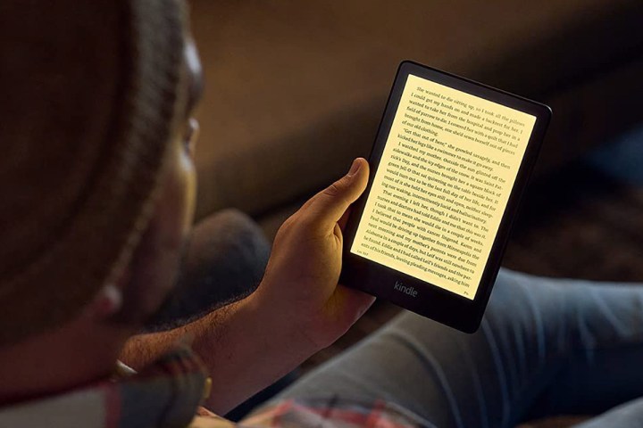 Person reading an Amazon Kindle Paperwhite.