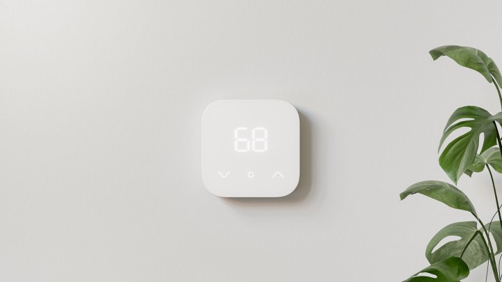 Amazon Smart Thermostat hanging on wall.