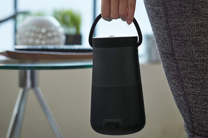 The Bose Soundlink Revolve Series II in a person's hand.