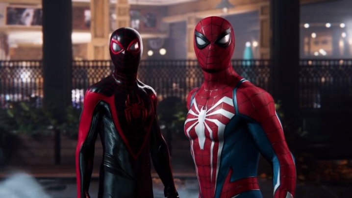 Miles Morales and Peter Parker stand together in Spider-Man 2.