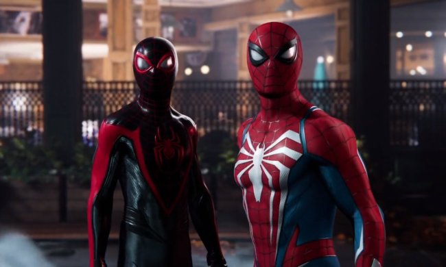 Miles Morales and Peter Parker stand together in Spider-Man 2.