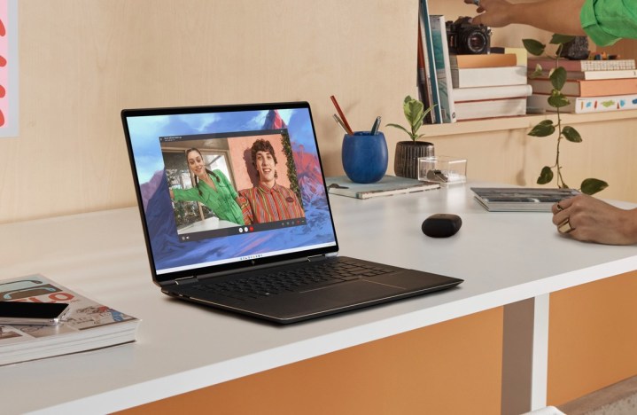 The HP Spectre x360 16 connected  a achromatic  desk.