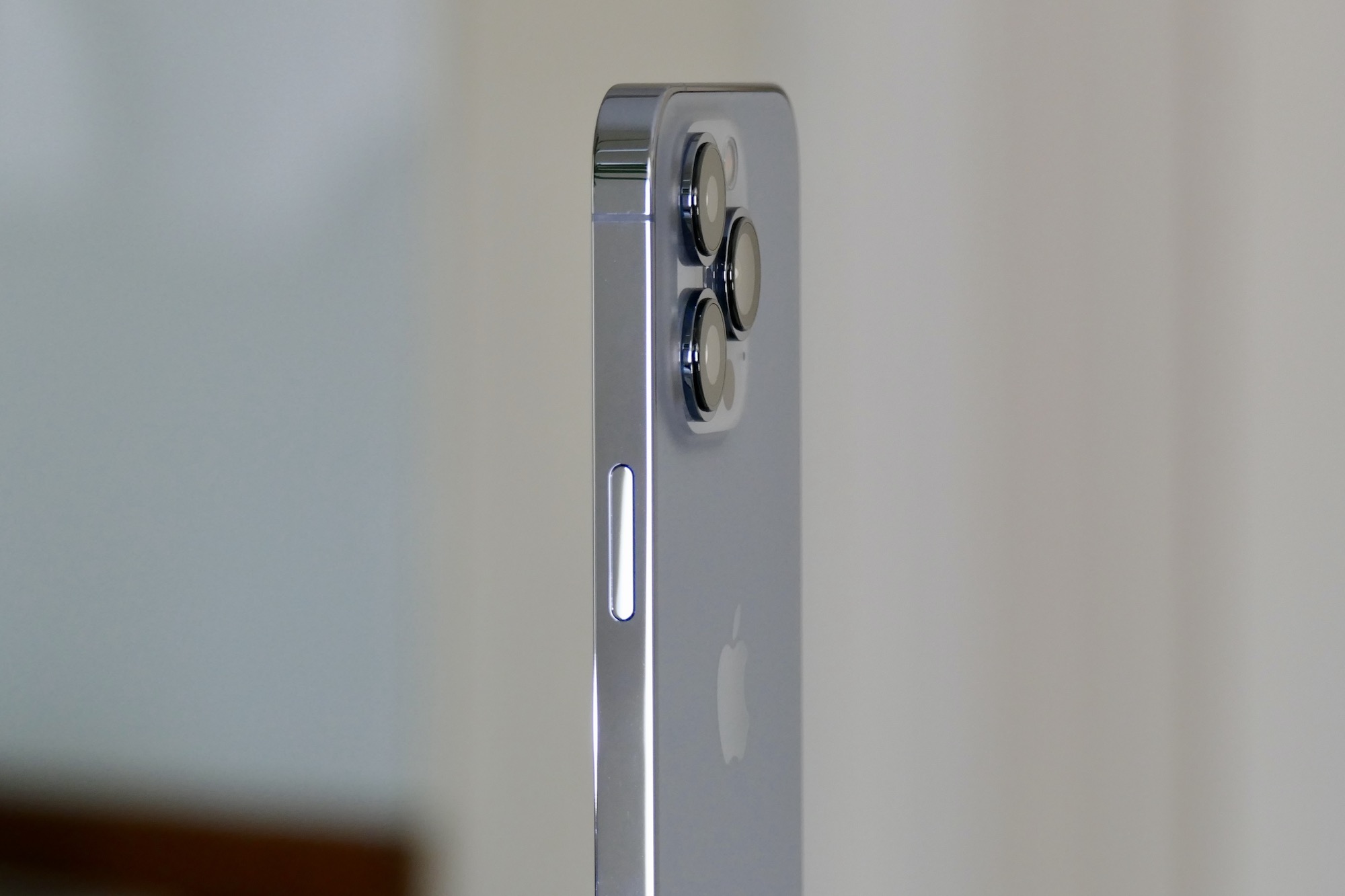 The iPhone 13 Pro's camera module seen from the side.