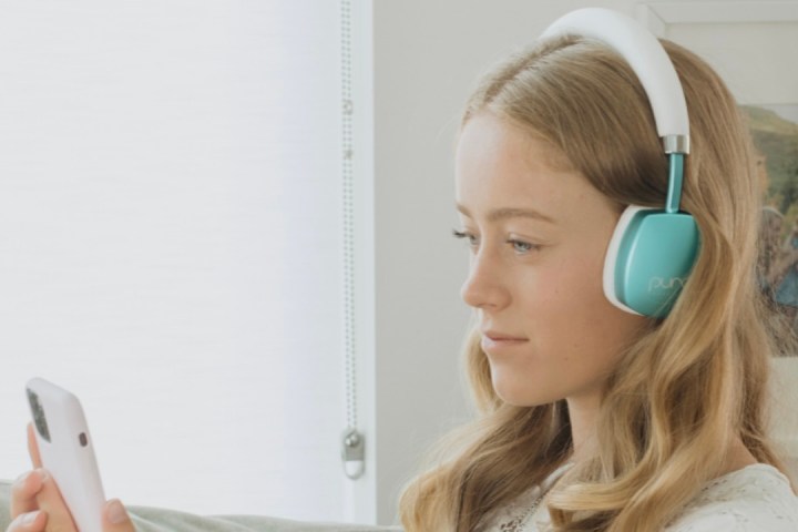 A teen using the Puro PuroQuiet headphones.