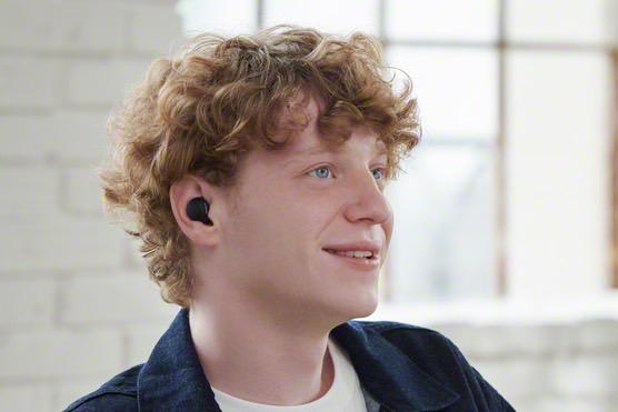 Man wearing Sony's CF-500 true wireless earbuds.
