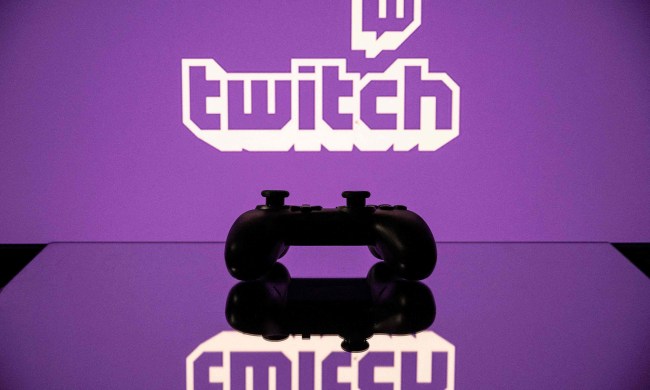 A gamepad is pictured as a screen displays the online Twitch platform.