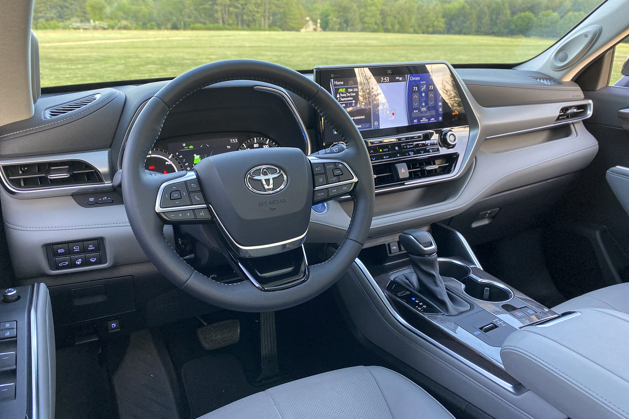Driver's side interior in the 2021 Toyota Highlander Hybrid Platinum.