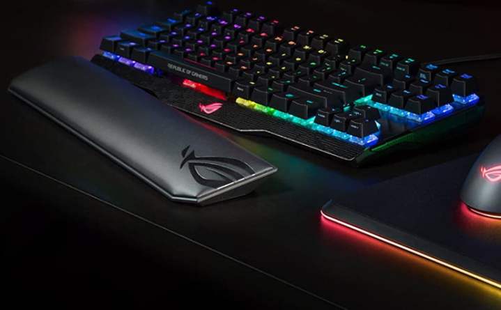 Close up of the Asus ROG Gaming Wrist Rest sitting on the table next to the keyboard and mouse.