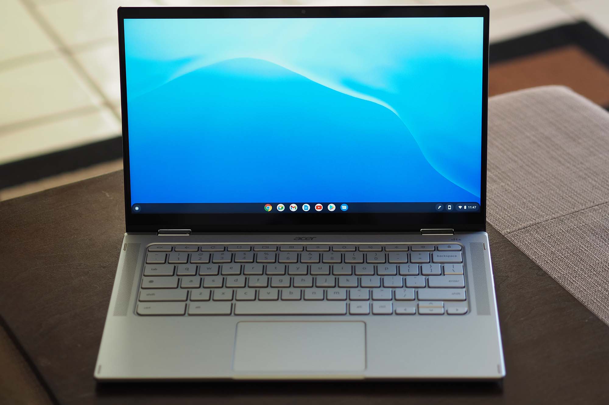An Acer Chromebook Spin 514 sitting on a table (front view).