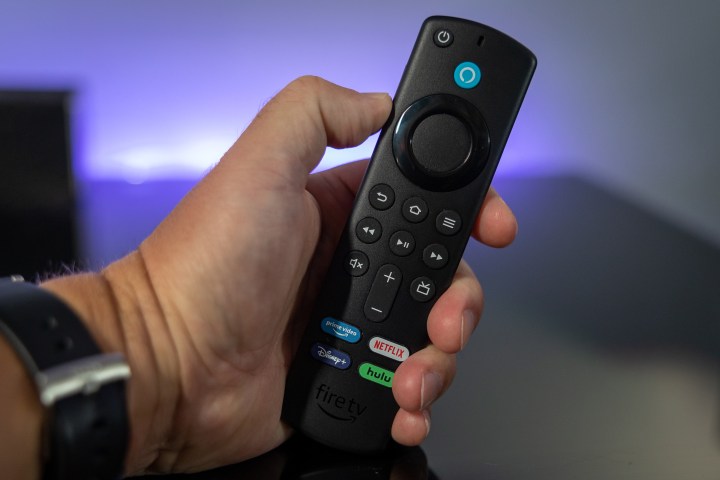 Amazon Fire TV Stick with TV controls.