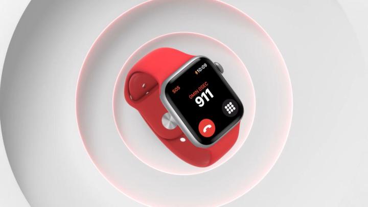 Apple Watch Series 6 smartwatch in red on a white textured background.