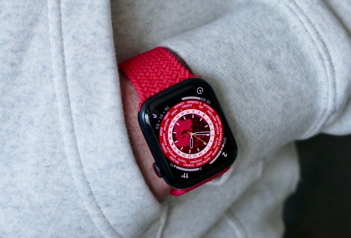 Apple Watch Series 7 on a wrist with hand tucked in to a sweatshirt pocket. 