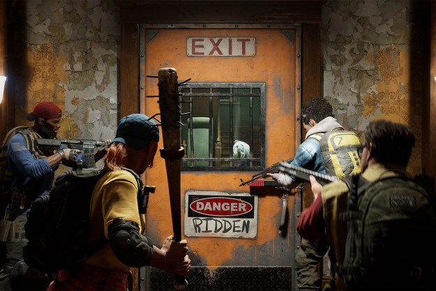 Players look out of a saferoom door in Back 4 Blood.