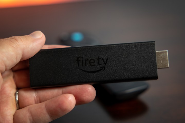 A person holding the Amazon Fire TV Stick 4K Max.