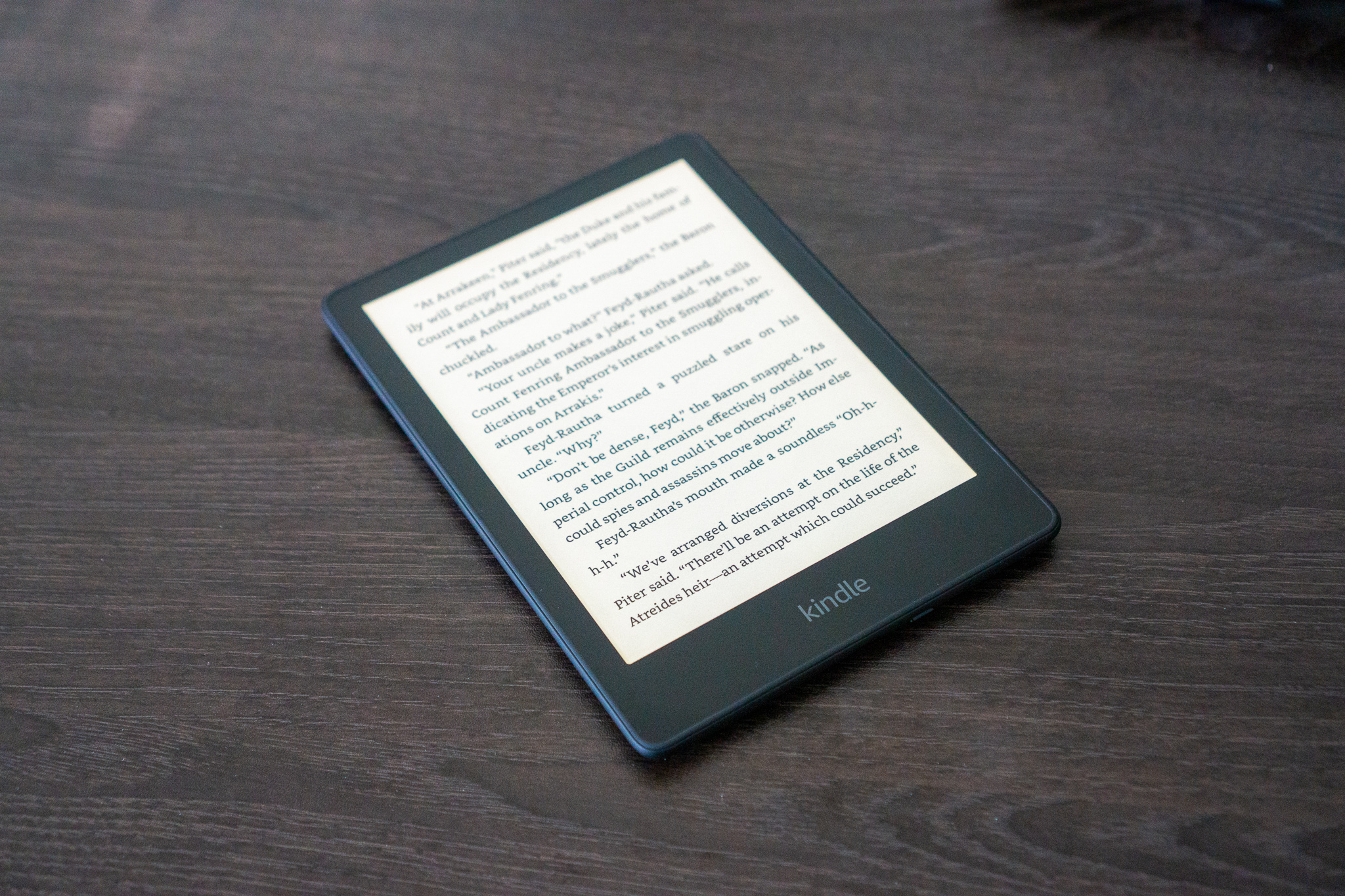 The Kindle Paperwhite sat on a table.