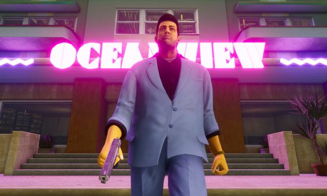 Grand Theft Auto City's main character stands in front of a neon sign.
