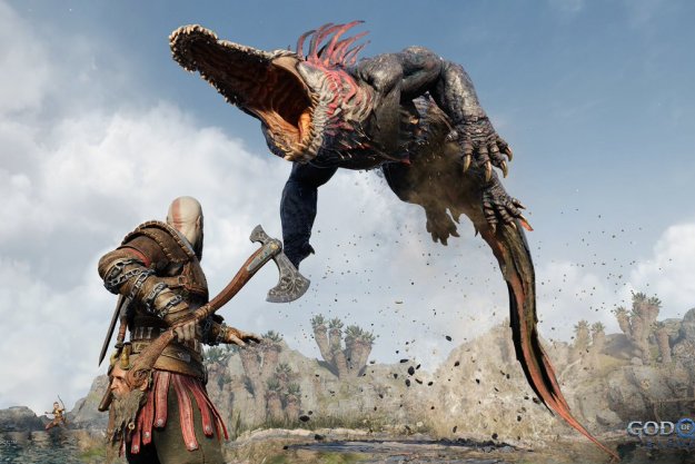 A giant lizard monster jumps on Kratos in God of War Ragnarok.