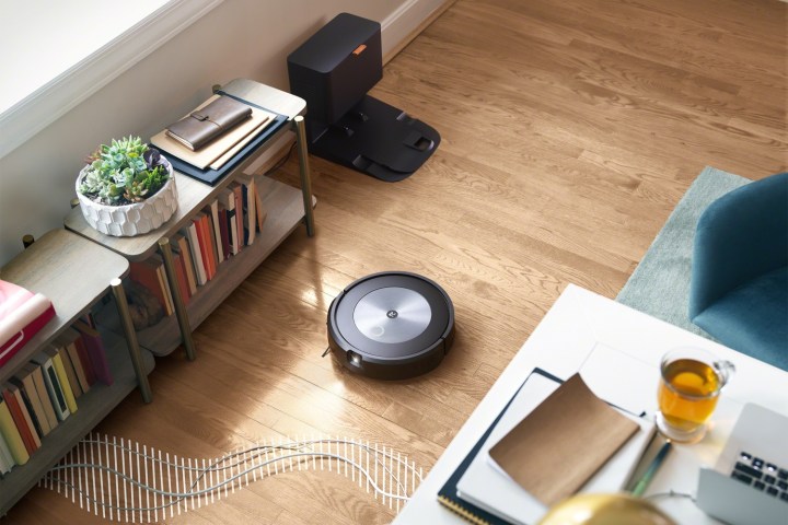 The iRobot Roomba i7 cleaning a living room.