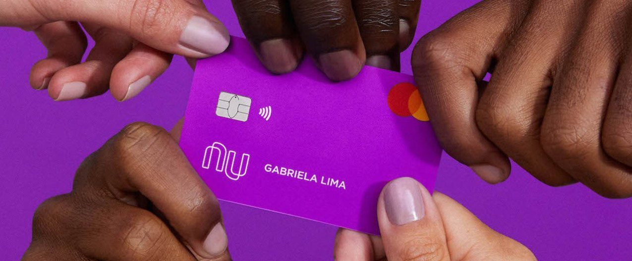 hands holding a Nubank card