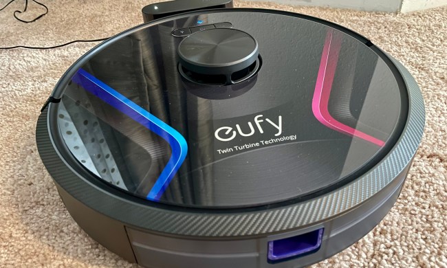 The RoboVac X8 docked on its charger.