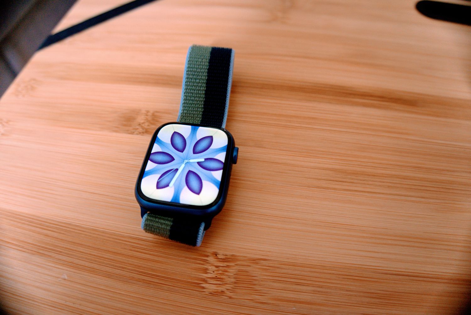 Apple Watch Series 7 with flower screen.