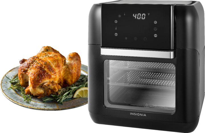 Insignia 10-quart Air Fry Oven next to a cooked chicken.