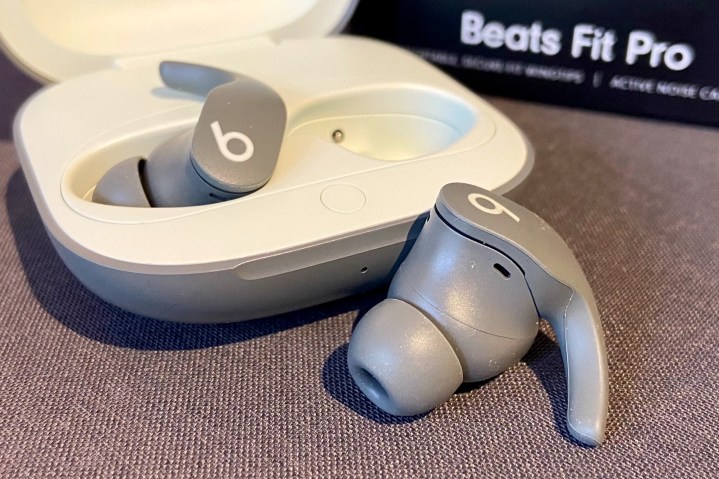 The Beats Fit Pro wireless earbuds and their charging case.