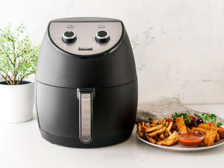 Bella Pro Series 4.2 quart air fryer with food on counter for family meals.