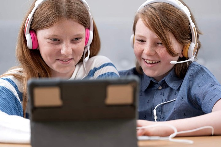 Kids wearing School Plus headphones.
