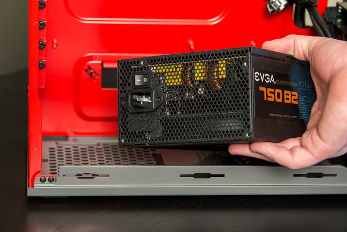 Install a power supply in a PC cover.