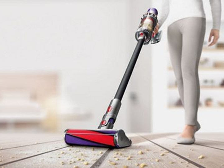 Dyson Cyclone V10 Absolute cleaning food on floor.
