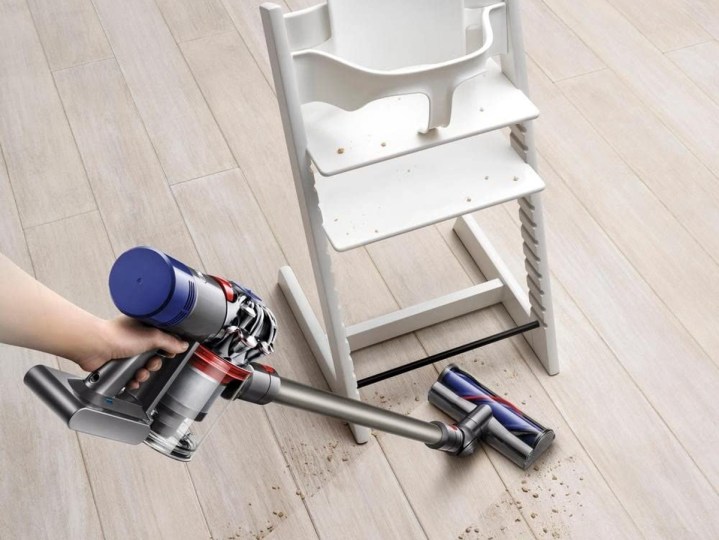 Dyson V8 Animal Cordless Stick Vacuum Cleaner, Iron, cleaning floor near baby chair.