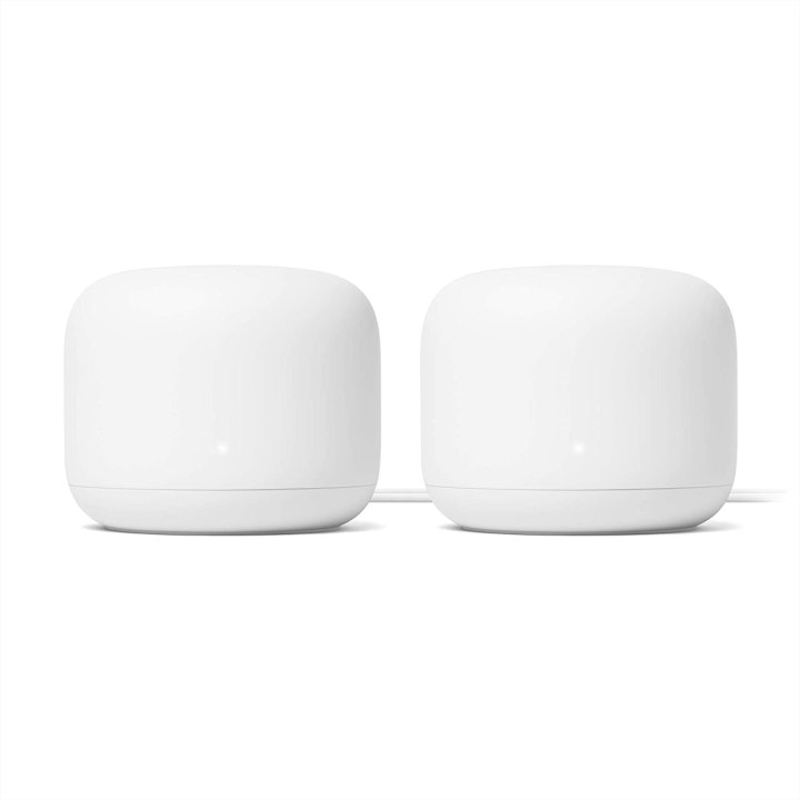 Two google nest wi-fi units, which incorporate a built-in smart speaker.