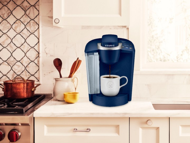 Keurig K-Classic K50 Single Serve K-Cup Pod Coffee Maker on a counter next to a range.
