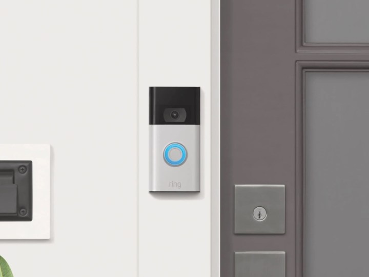 The Ring Video Doorbell is satin nickel, mounted next to the doorway.