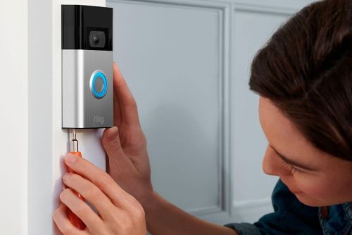 Person installing Ring video doorbell
